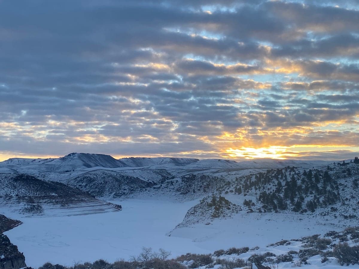 Snow-covered shoreline and evening sky at Blue Mesa Reservoir.