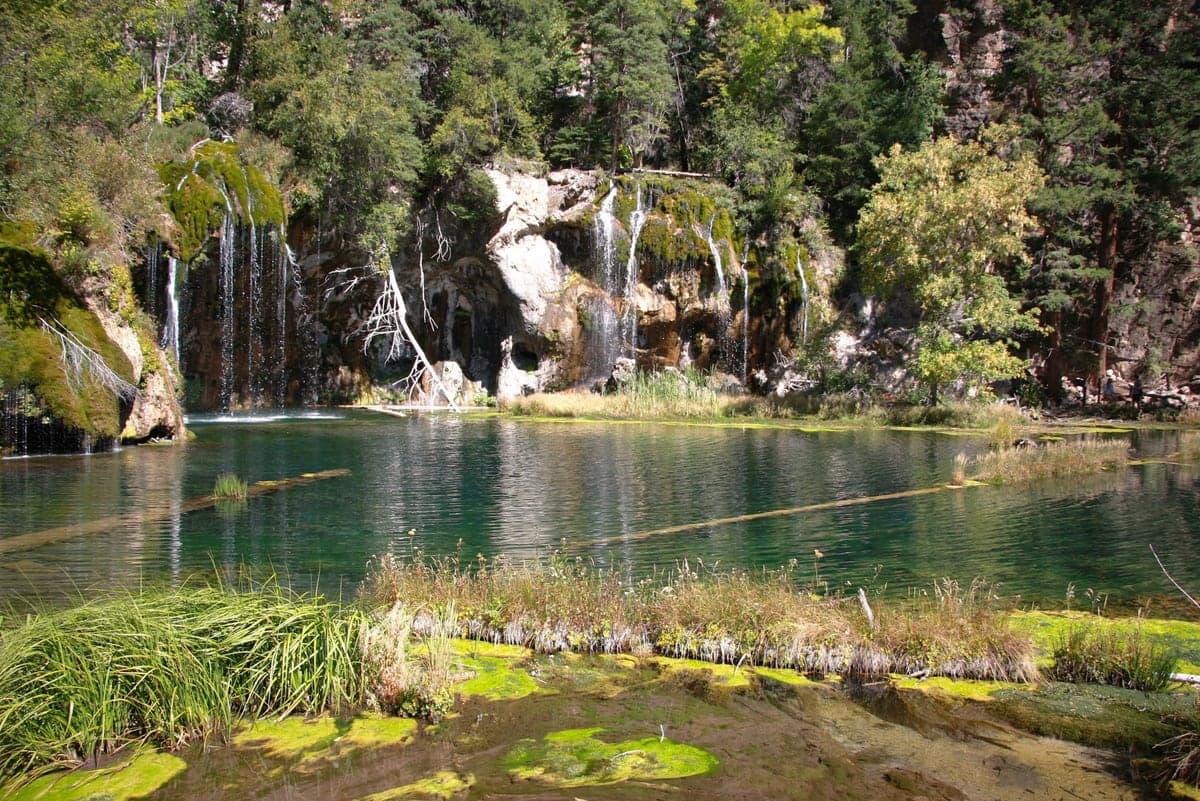 Clear green water and small waterfalls at Hanging Lake in Glenwood Canyon