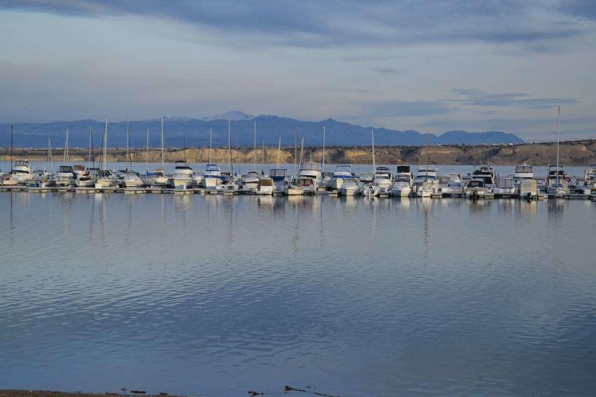 Rows of boats sit at a full-service marina on Pueblo Reservoir.