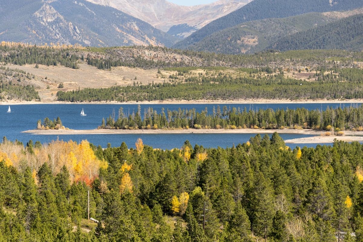 Heaton Bay and Sentinel Island in Dillon Reservoir beneath the Summit County mountains.