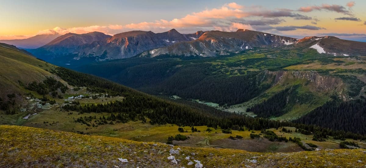 Sunrise over Forest Canyon and the alpine peaks of Rocky Mountain National Park.