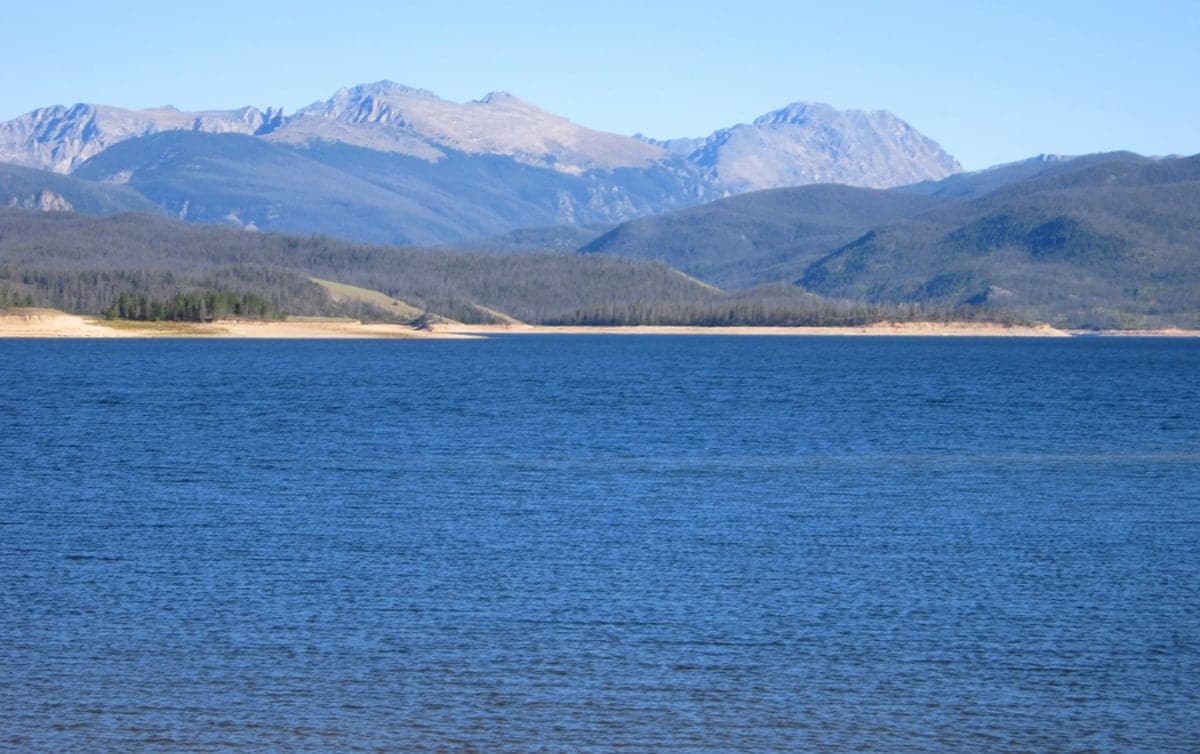 Lake Granby stretching toward forested Colorado mountain slopes.