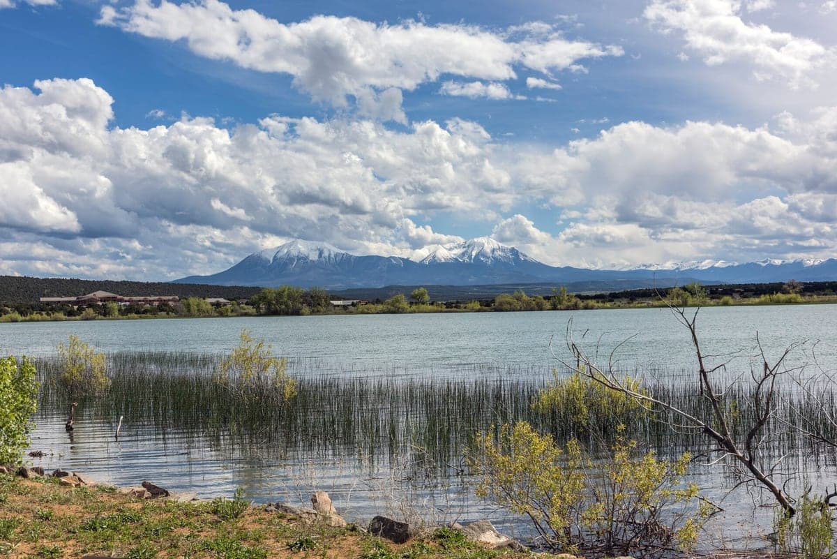The twin Spanish Peaks rising beyond Martin Lake in Lathrop State Park.