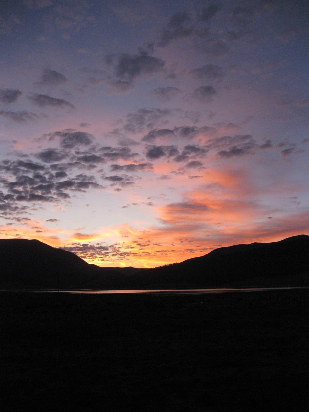Pink sunrise clouds above Eagle Nest Lake and the Moreno Valley.
