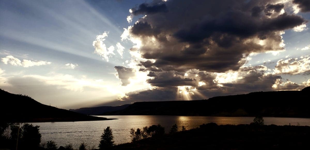 Dusk light breaking over Blue Mesa Reservoir in Curecanti National Recreation Area.