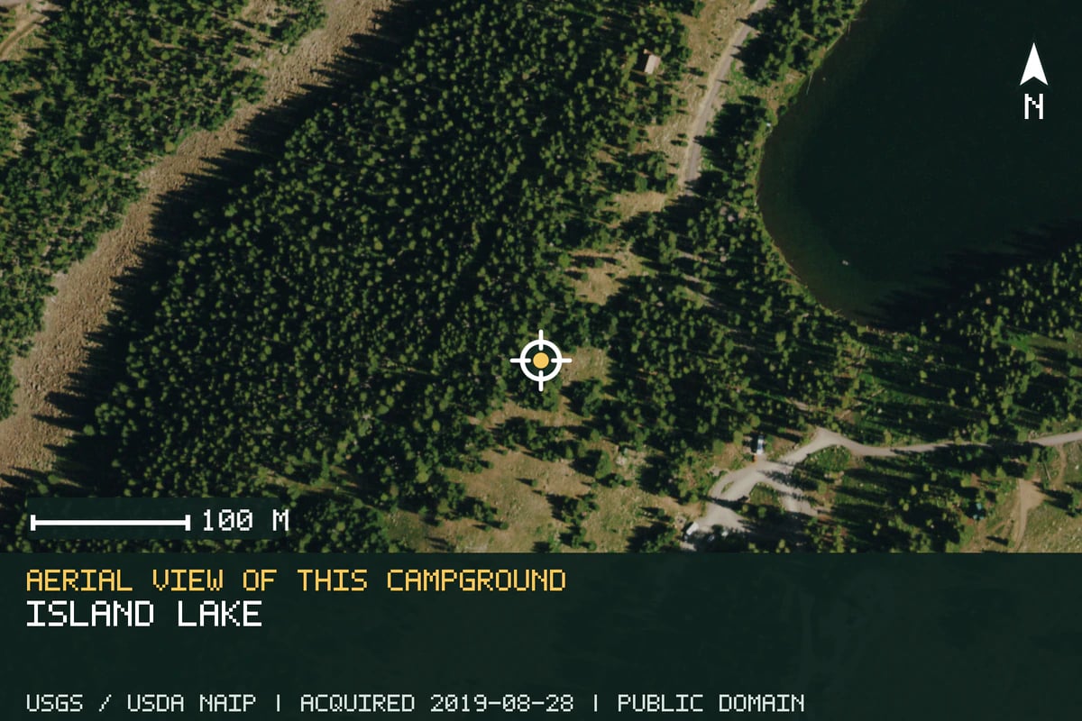 Aerial view of Island Lake, with the verified campground location marked.