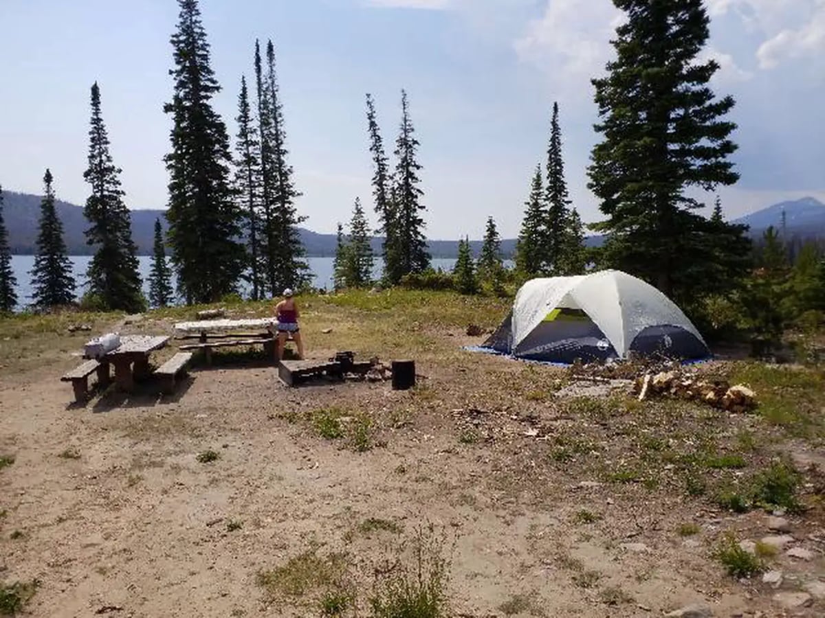 Tent, picnic table, and fire ring at Big Creek Lakes Campground site 2 beside the lake
