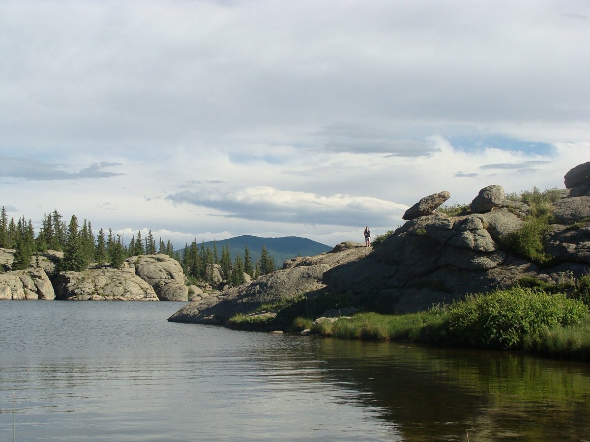 Rocky shoreline and blue water at Eleven Mile Reservoir.